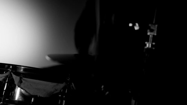 ECU OF UNRECOGNIZABLE DRUMMER ON THE HI-HAT AND SNARE.  FULL HD IN BLACK AND WHITE.