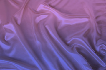 soft folds on delicate pink, lilac shining silk, luxury concept, background for the designer, horizontal, close-up, copy space