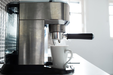 Close-up of making coffee in a coffee machine.
