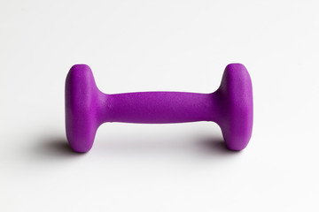 Small purple neoprene coated dumbbell isolated on white.