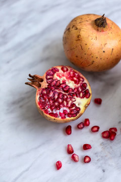 Pomegranate on a white marble table