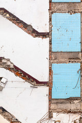 Demolished House Profile at Old Wall / Detail backdrop wall of gutted building with remained position of stairs, floor and tiles (copy space)