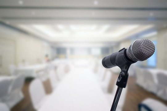 Microphone over the blurred business forum Meeting or Conference Room Concept, Blurred background.