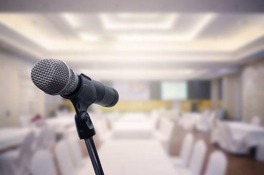 Microphone over the blurred business forum Meeting or Conference Room Concept, Blurred background.