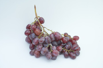 Fresh bunch of grapes on white background.