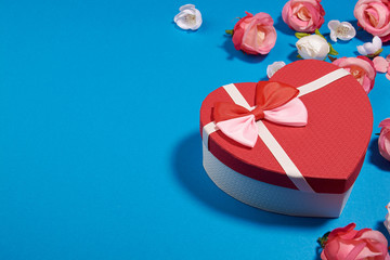 The Background Of Valentine's Day. Gifts, flowers, heart, box in pastel blue colors. The Concept Of Valentine's Day. Flat sunbed, top view, copy space