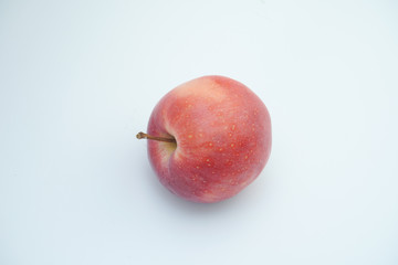 Fresh red apple on white background.