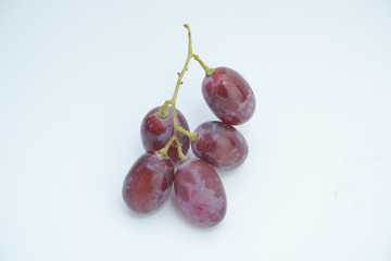Fresh bunch of grapes on white background.