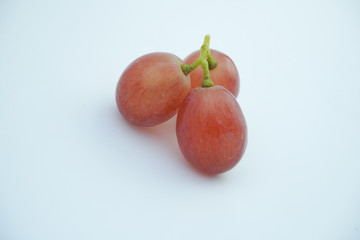 Fresh bunch of grapes on white background.