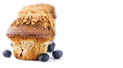 Some Blueberry Muffins isolated on white (selective focus)