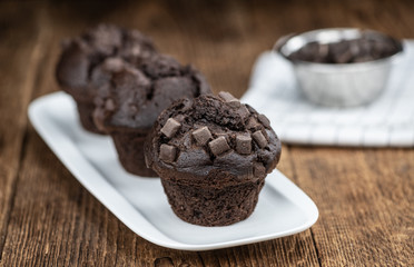 Chocolate Muffins (selective focus; detailed close-up shot)