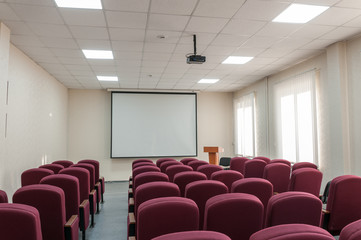 Modern conference room with comfortable Burgundy chairs