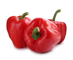 Ripe red bell peppers isolated on white