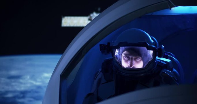 Astronaut looking out of spaceship window