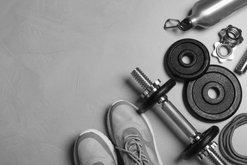 Gym equipment on light grey background, flat lay