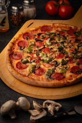 Full delicious pizza displayed on a peel