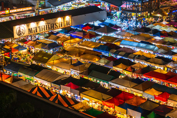 Top view of Train Night Market Ratchada (Talad Rot Fai). market with plenty of shops with colorful...