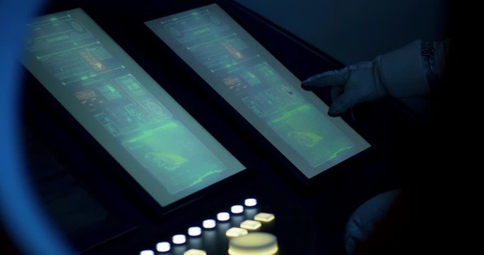 Astronauts using spaceship control panel