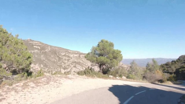 Hyperlapse driving descent mountain road blue sky