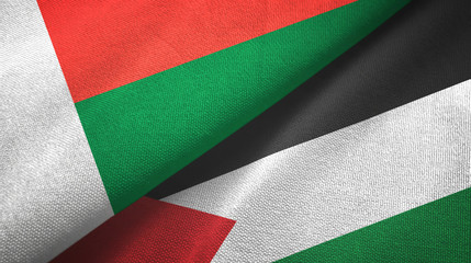 Madagascar and Palestine two flags textile cloth, fabric texture