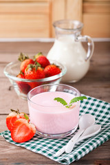 Strawberry yogurt and milk on a table. Selective focus. Copy space