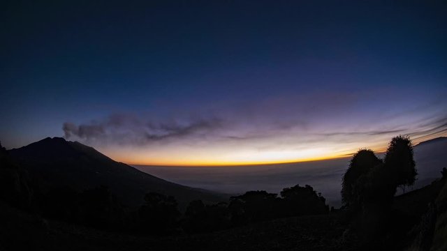 Night Time lapse near of the active Turrialba Volcano in Costa Rica at beautiful sunrise.