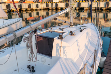 White sailing yacht stands on the pier