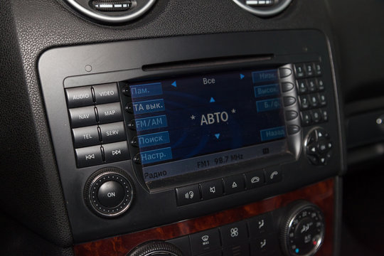 View to black interior of Mercedes Benz ML350 M class with dashboard, media system cleaning before sale on parking