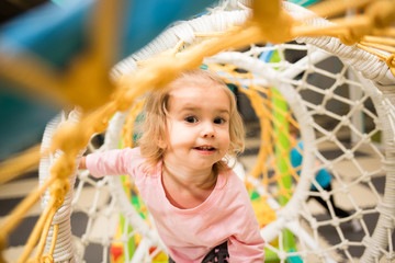 Toddler Crawling Through Netted Tunnel