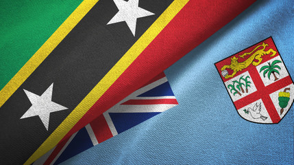 Saint Kitts and Nevis and Fiji two flags textile cloth, fabric texture