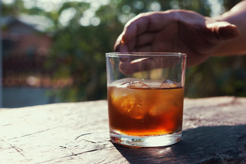 Concept of Withdrawal Symptoms from alcohol or Alcoholic diseases.Hand with a glass of whiskey on...