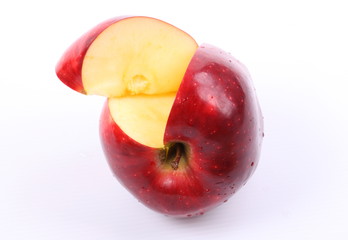 Red apple with water drops isolated on white background.