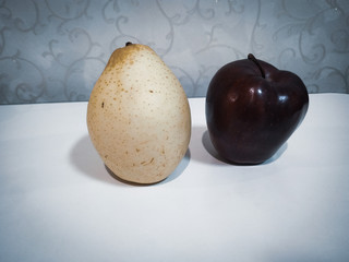 pear and apple isolated on cool background