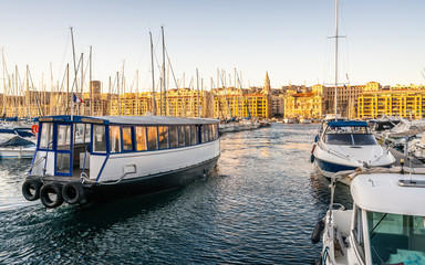 Marseille Vieux Port or old port view with ferry boat crossing to the city hall in Marseille France