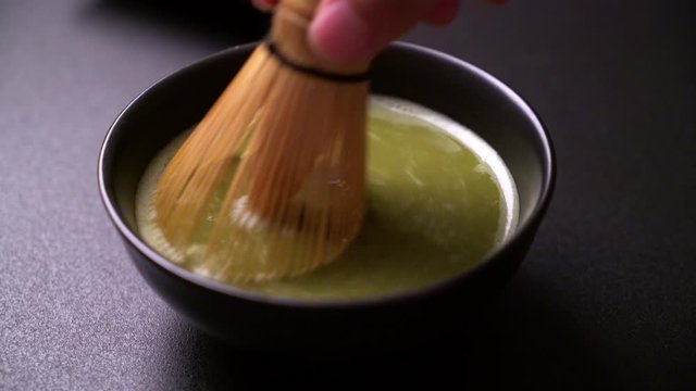 making matcha green tea in Japanese style