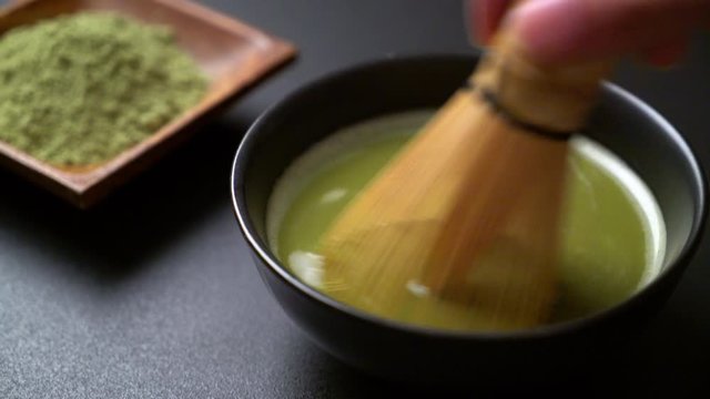 making matcha green tea in Japanese style