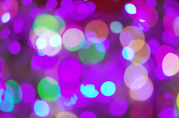 Fototapeta premium Celebratory background from multi-colored circles. Defocused shooting of colored light sources.