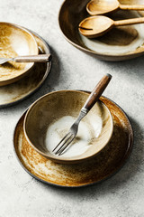 Ceramic tableware. Salad bowls, plates and forks.