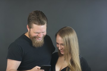 Couple in thirties doing studio photo shoot