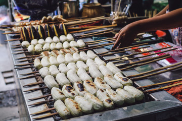 Thailand floating market.cultivated banana fruit on a hot charcoal grill in Thailand outdoor market,It's a traditional Thai cuisine food gourmet