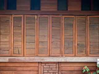 wood wall and window on stones basement