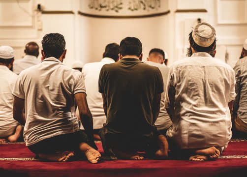 Closeup Shot Of Muslim People Worshiping In The Mosque
