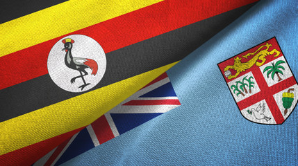 Fototapeta premium Uganda and Fiji two flags textile cloth, fabric texture