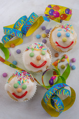 carnival clown muffins decorated with multi colored chocolate lentils