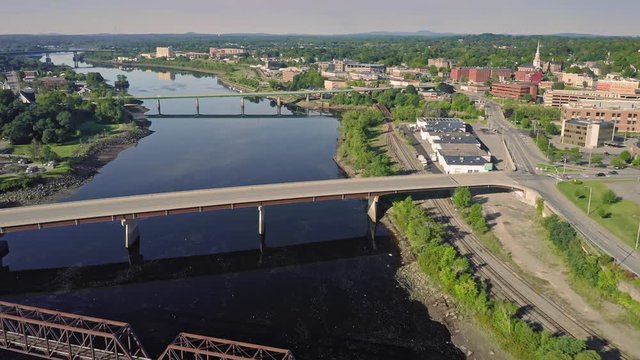 Aerial: Flying over bridges crossing the Penobscot River. Bangor, Maine, USA