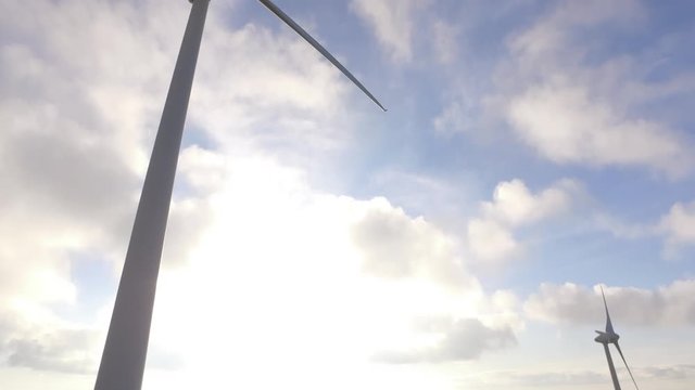 eolic turbine wind renewable energy farm on top of mountain 4k