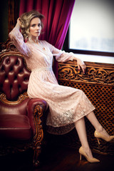 Fototapeta premium woman in armchair