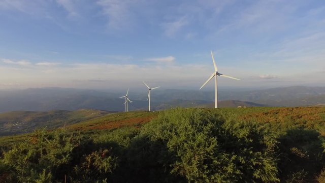 eolic turbine wind renewable energy farm on top of mountain 4k