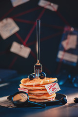 Creative food photography, a stack of pancakes with top-secret documents, spy concept
