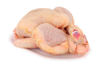Fresh raw poussin chicken sometimes called spring chicken isolated on a white background